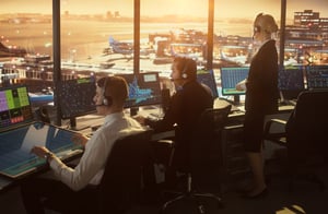 People working in an airport control tower